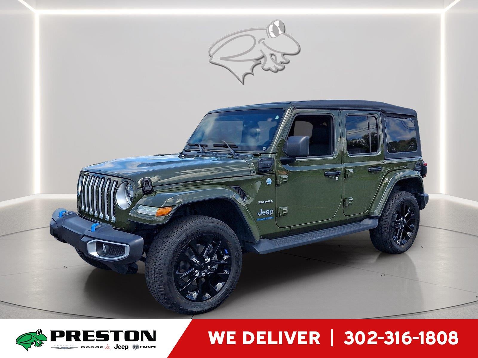 2023 Jeep Wrangler 4xe Sahara in Sarge Green Clearcoat — front three-quarter view
