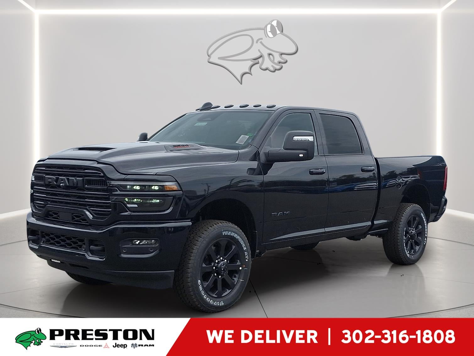2026 RAM 2500 Laramie in Diamond Black Crystal Pearlcoat — front three-quarter view